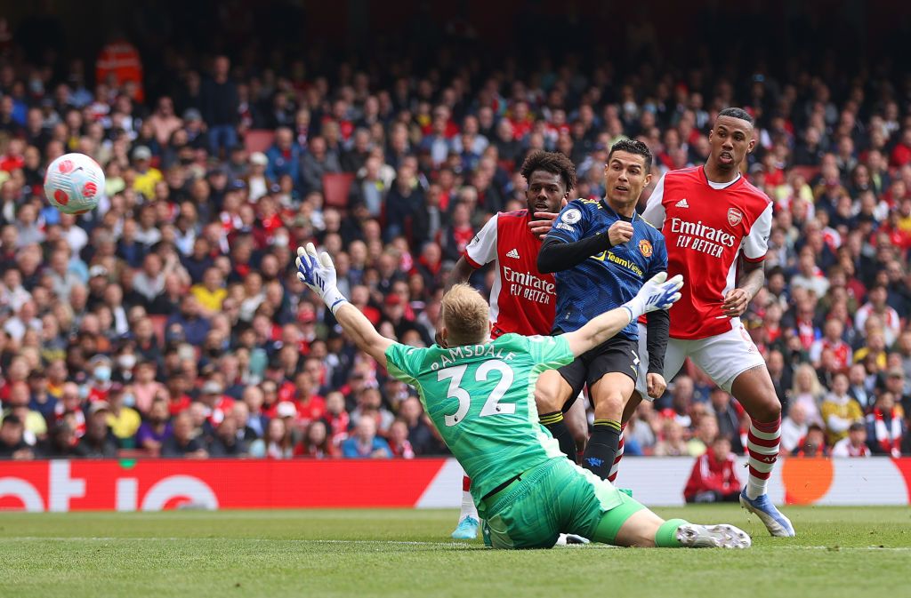 LONDON, ENGLAND - APRIL 23: Cristiano Ronaldo of Manchester United scores their side's first goal during the Premier League match between Arsenal and Manchester United at Emirates Stadium on April 23, 2022 in London, England. (Photo by Catherine Ivill/Getty Images)