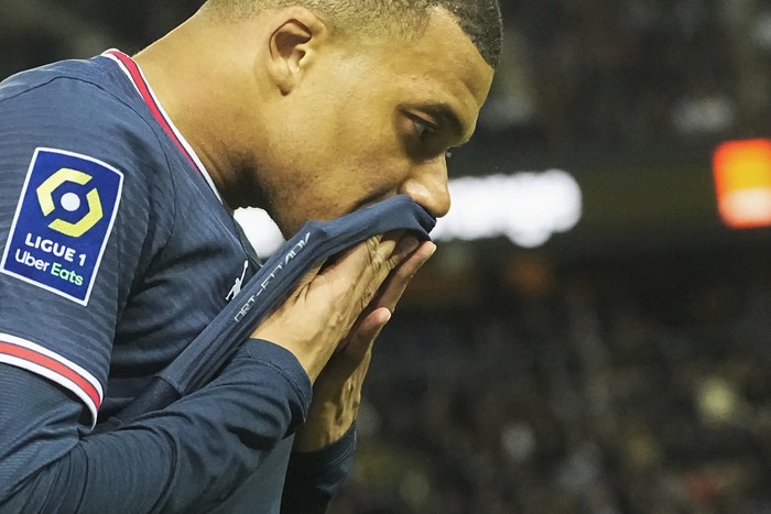 PSGs Kylian Mbappe reacts after missing a chance during the French League One soccer match between Paris Saint Germain and Lens at Parc des Princes stadium in Paris, Saturday, April 23, 2022. (AP Photo/Michel Euler)