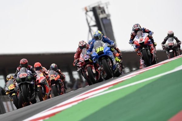 MotoGP riders Fabio Quartararo of France, Jack Miller of Australia, Joan Mir of Spain and Johann Zarco of France, foreground from left to right, lead at the start of the Algarve Motorcycle Grand Prix, at the Algarve International circuit near Portimao, Portugal, Sunday, April 24, 2022. (AP Photo/Jose Breton)