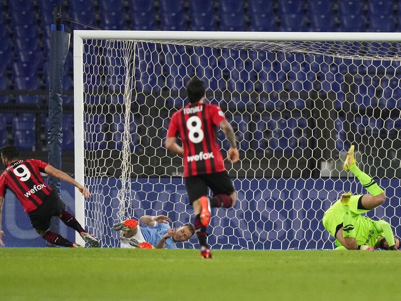 Lazio's Ciro Immobile, centre, scores his side's opening goal during the Serie A soccer match between Lazio and AC Milan, at Rome's Olympic Stadium, Italy, Sunday, April 24, 2022. (AP Photo/Andrew Medichini)