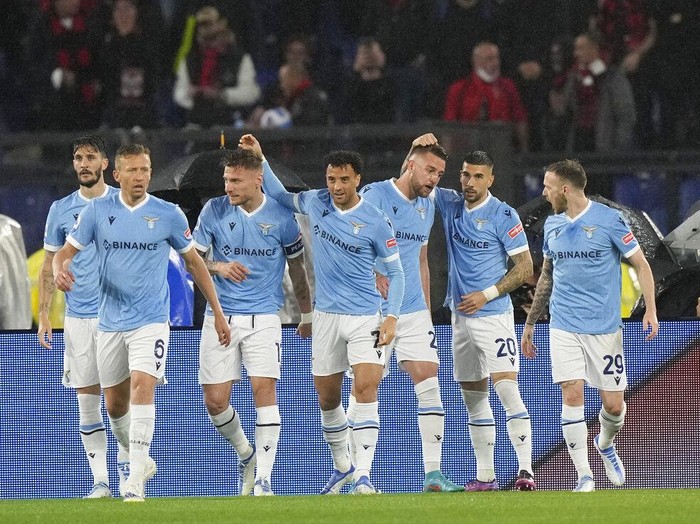 Lazio's Ciro Immobile, centre, scores his side's opening goal during the Serie A soccer match between Lazio and AC Milan, at Rome's Olympic Stadium, Italy, Sunday, April 24, 2022. (AP Photo/Andrew Medichini)