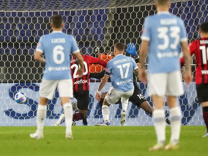 Lazio's Ciro Immobile, centre, scores his side's opening goal during the Serie A soccer match between Lazio and AC Milan, at Rome's Olympic Stadium, Italy, Sunday, April 24, 2022. (AP Photo/Andrew Medichini)