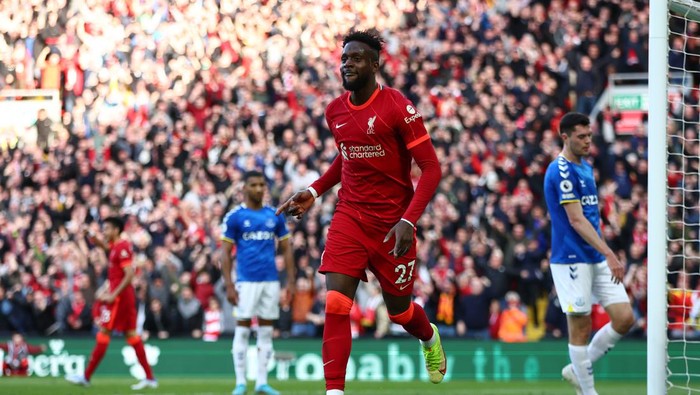 LIVERPOOL, ENGLAND - APRIL 24: Divock Origi of Liverpool celebrates after scoring their teams second goal during the Premier League match between Liverpool and Everton at Anfield on April 24, 2022 in Liverpool, England. (Photo by Clive Brunskill/Getty Images)