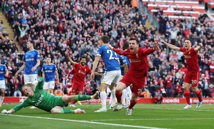 Soccer Football - Premier League - Liverpool v Everton - Anfield, Liverpool, Britain - April 24, 2022  Liverpools Andrew Robertson celebrates scoring their first goal REUTERS/Phil Noble EDITORIAL USE ONLY. No use with unauthorized audio, video, data, fixture lists, club/league logos or live services. Online in-match use limited to 75 images, no video emulation. No use in betting, games or single club /league/player publications.  Please contact your account representative for further details.
