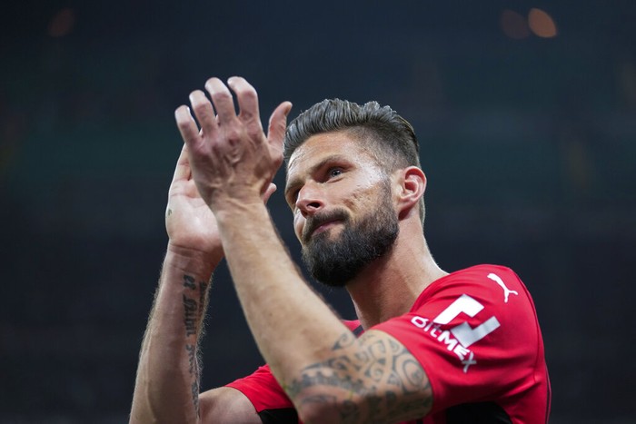 AC Milans Olivier Giroud applauds to supporters as he leaves the pitch during the Serie A soccer match between AC Milan and Genoa, at the San Siro stadium in Milan, Italy, Friday, April 15, 2022. (AP Photo/Luca Bruno)