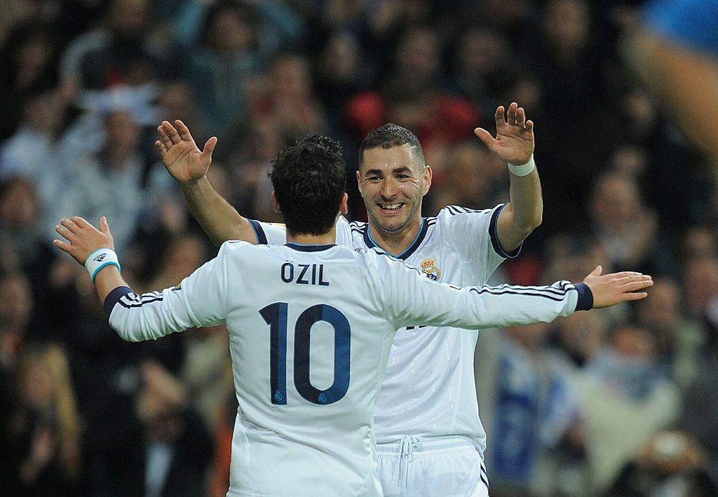 MADRID, SPAIN - NOVEMBER 17: Mesut Ozil of Real Madrid celebrates with Karim Benzema after scoring Real's 4th goal during the La Liga match between Real Madrid CF and Athletic Club de Bilbao at estadio Santiago Bernabeu on November 17, 2012 in Madrid, Spain. (Photo by Denis Doyle/Getty Images)