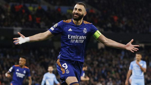 Soccer Football - Champions League - Semi Final - First Leg - Manchester City v Real Madrid - Etihad Stadium, Manchester, Britain - April 26, 2022 Real Madrid's Karim Benzema celebrates scoring their third goal REUTERS/Craig Brough