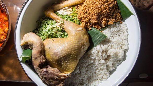 Boiled whole chicken is a Javanese Traditional dish, served in a large white bowl, which is Cooked for Celebration Rituals in Javanese Culture.