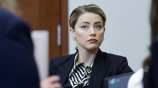 Actor Amber Heard appears in the courtroom at the Fairfax County Circuit Court in Fairfax, Va., Wednesday, April 27, 2022. Actor Johnny Depp sued his ex-wife actress Amber Heard for libel in Fairfax County Circuit Court after she wrote an op-ed piece in The Washington Post in 2018 referring to herself as a 