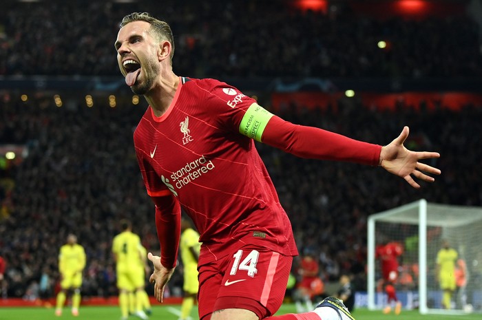 LIVERPOOL, ENGLAND - APRIL 27: Jordan Henderson of Liverpool celebrates after their teams first goal which came through a Geronimo Rulli of Villarreal CF (not pictured) own goal during the UEFA Champions League Semi Final Leg One match between Liverpool and Villarreal at Anfield on April 27, 2022 in Liverpool, England. (Photo by David Ramos/Getty Images)
