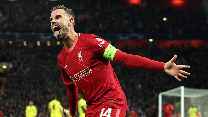 LIVERPOOL, ENGLAND - APRIL 27: Jordan Henderson of Liverpool celebrates after their teams first goal which came through a Geronimo Rulli of Villarreal CF (not pictured) own goal during the UEFA Champions League Semi Final Leg One match between Liverpool and Villarreal at Anfield on April 27, 2022 in Liverpool, England. (Photo by David Ramos/Getty Images)