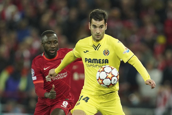 Villarreals Manu Trigueros, right, is challenged by Liverpools Naby Keita during the Champions League semi final, first leg soccer match between Liverpool and Villarreal at Anfield stadium in Liverpool, England, Wednesday, April 27, 2022. (AP Photo/Jon Super)