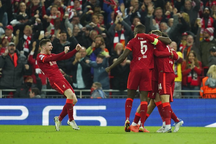 Liverpool vs Villarreal Liverpool players celebrate after Villarreal's Pervis Estupinan scored an own goal during the Champions League semi final, first leg soccer match between Liverpool and Villarreal at Anfield stadium in Liverpool, England, Wednesday, April 27, 2022. (AP Photo/Jon Super)