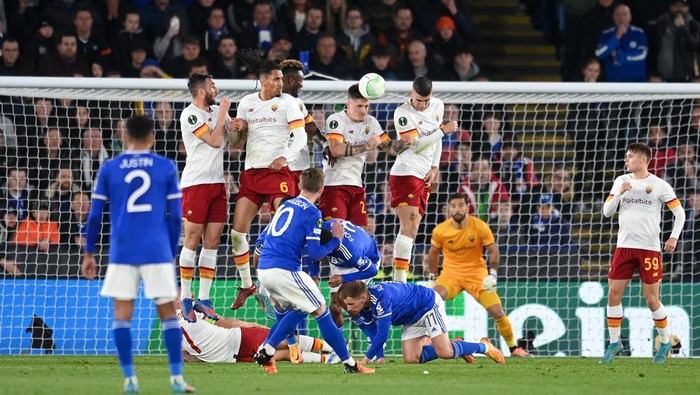 LEICESTER, ENGLAND - APRIL 28: James Maddison of Leicester City hits the wall while taking their sides free kick during the UEFA Conference League Semi Final Leg One match between Leicester City and AS Roma at The King Power Stadium on April 28, 2022 in Leicester, England. (Photo by Michael Regan/Getty Images)