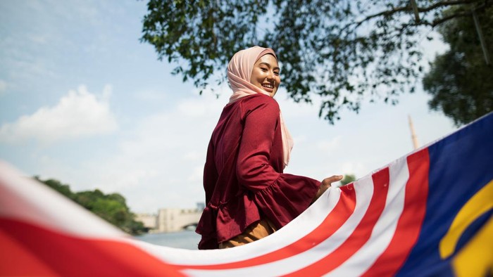 Beautiful asian women celebrating Malaysia independence day outdoor