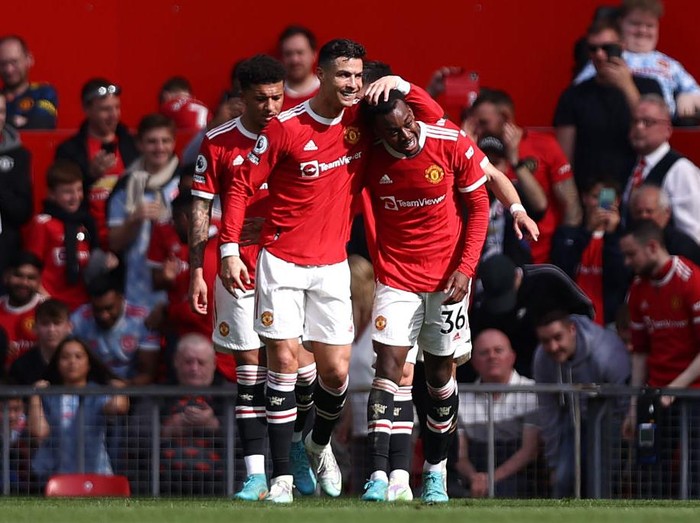 MANCHESTER, ENGLAND - APRIL 16: Cristiano Ronaldo of Manchester United celebrates with team mate Anthony Elanga after scoring their sides second goal during the Premier League match between Manchester United and Norwich City at Old Trafford on April 16, 2022 in Manchester, England. (Photo by Naomi Baker/Getty Images)