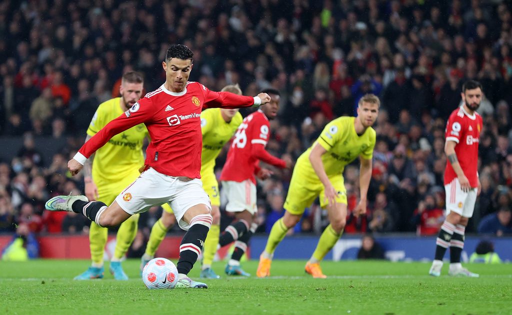 MANCHESTER, ENGLAND - MAY 02: Cristiano Ronaldo of Manchester United scores their side's second goal from a penalty during the Premier League match between Manchester United and Brentford at Old Trafford on May 02, 2022 in Manchester, England. (Photo by Catherine Ivill/Getty Images)