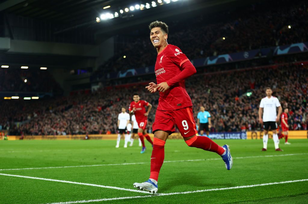 LIVERPOOL, ENGLAND - APRIL 13: Roberto Firmino of Liverpool celebrates after scoring their team's second goal during the UEFA Champions League Quarter Final Leg Two match between Liverpool FC and SL Benfica at Anfield on April 13, 2022 in Liverpool, England. (Photo by Clive Brunskill/Getty Images)