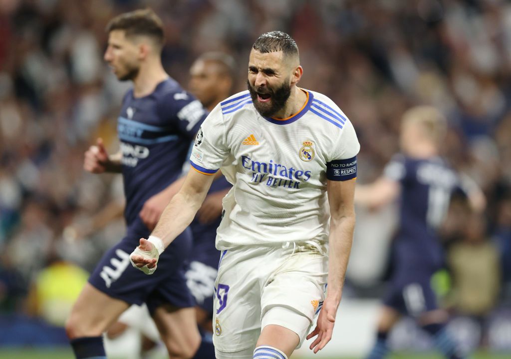 MADRID, SPAIN - MAY 04: Karim Benzema of Real Madrid celebrates after scoring their side's third goal during the UEFA Champions League Semi Final Leg Two match between Real Madrid and Manchester City at Estadio Santiago Bernabeu on May 04, 2022 in Madrid, Spain. (Photo by Gonzalo Arroyo Moreno/Getty Images)