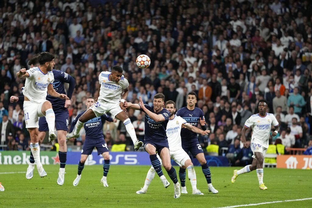 Real Madrid's Rodrygo scores his side's second goal during the Champions League semi final, second leg, soccer match between Real Madrid and Manchester City at the Santiago Bernabeu stadium in Madrid, Spain, Wednesday, May 4, 2022. (AP Photo/Bernat Armangue)