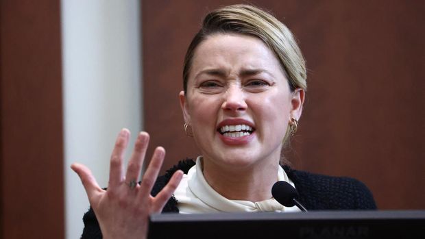 Amber Heard US actress Amber Heard testifies at the Fairfax County Circuit Courthouse in Fairfax, Virginia, on May 5, 2022. - Actor Johnny Depp is suing ex-wife Amber Heard for libel after she wrote an op-ed piece in The Washington Post in 2018 referring to herself as a public figure representing domestic abuse. (Photo by Jim LO SCALZO / POOL / AFP)