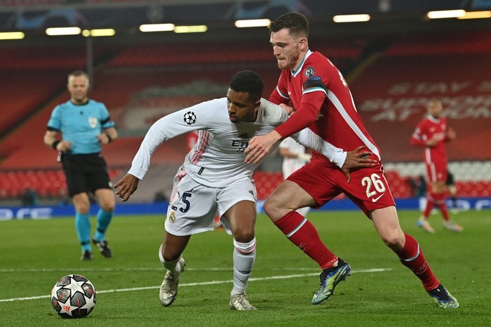 Real Madrids Brazilian forward Rodrygo (L) vies with Liverpools Scottish defender Andrew Robertson during the UEFA Champions League quarter final second leg football match between Liverpool and Real Madrid at Anfield in Liverpool, north west   on April 14, 2021. (Photo by Paul ELLIS / AFP)