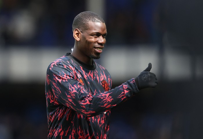 Soccer Football - Premier League - Everton v Manchester United - Goodison Park, Liverpool, Britain - April 9, 2022 Manchester Uniteds Paul Pogba during the warm up before the match REUTERS/Phil Noble EDITORIAL USE ONLY. No use with unauthorized audio, video, data, fixture lists, club/league logos or live services. Online in-match use limited to 75 images, no video emulation. No use in betting, games or single club /league/player publications.  Please contact your account representative for further details.
