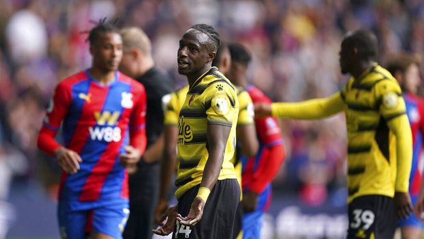 Watford's Hassane Kamara reacts to being shown a red card, during the Premier League match between Crystal Palace and Watford at Selhurst Park, London, Saturday May 7, 2022. (Yui Mok/PA via AP)