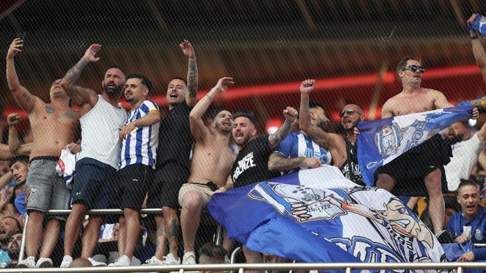 FC Porto supporters cheer on the stands celebrating winning the Portuguese league after their team defeated Benfica 1-0 in a league soccer match at the Luz stadium in Lisbon, Saturday, May 7, 2022. (AP Photo/Pedro Rocha)
