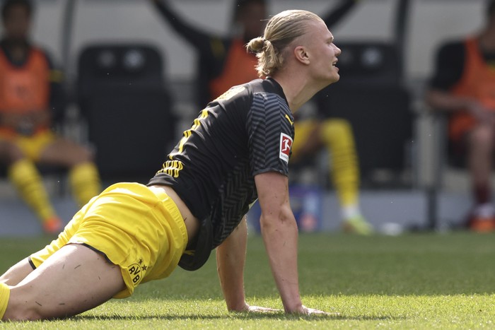 Dortmunds Erling Haaland lies on a German Bundesliga soccer match between Greuther Fuerth and Borussia Dortmund in Fuerth, Germany, Saturday, May 7, 2022. (Daniel Karmann/dpa  via AP)