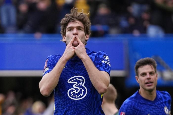 Chelseas Marcos Alonso celebrates after scoring his sides second goal during the English FA Cup fourth round soccer match between Chelsea and Plymouth Argyle at Stamford Bridge Stadium in London, Saturday, Feb. 5, 2022. (AP Photo/Matt Dunham)