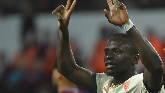 Liverpool's Sadio Mane celebrates after scoring against Aston Villa during the English Premier League soccer match between Aston Villa and Liverpool at Villa Park in Birmingham, England, Tuesday, May 10, 2022. (AP Photo/Rui Vieira)