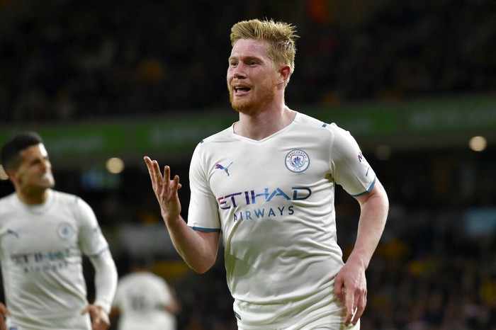 Manchester Citys Kevin De Bruyne celebrates after scoring his fourth goal during the English Premier League soccer match between Wolverhampton Wanderers and Manchester City at Molineux stadium in Wolverhampton, England, Wednesday, May 11, 2022. (AP Photo/Rui Vieira)