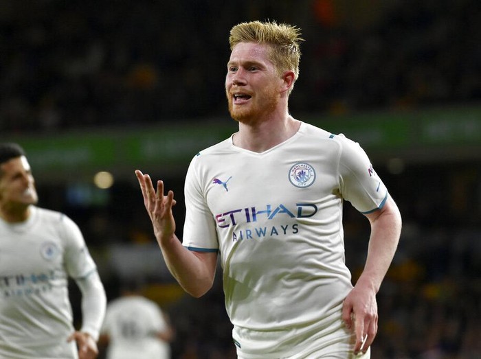 Manchester City's Kevin De Bruyne celebrates after scoring his fourth goal during the English Premier League soccer match between Wolverhampton Wanderers and Manchester City at Molineux stadium in Wolverhampton, England, Wednesday, May 11, 2022. (AP Photo/Rui Vieira)