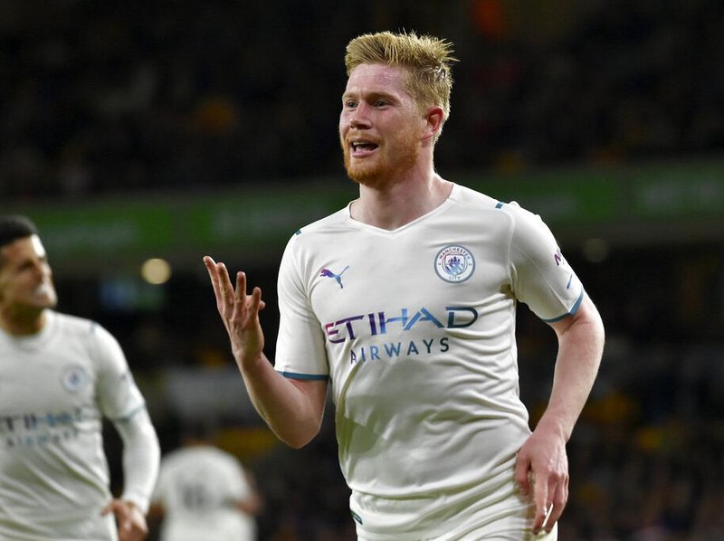 Manchester City's Kevin De Bruyne celebrates after scoring his fourth goal during the English Premier League soccer match between Wolverhampton Wanderers and Manchester City at Molineux stadium in Wolverhampton, England, Wednesday, May 11, 2022. (AP Photo/Rui Vieira)