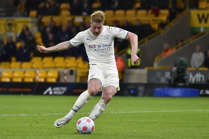 Manchester City's Kevin De Bruyne scores his fourth goal during the English Premier League soccer match between Wolverhampton Wanderers and Manchester City at Molineux stadium in Wolverhampton, England, Wednesday, May 11, 2022. (AP Photo/Rui Vieira)