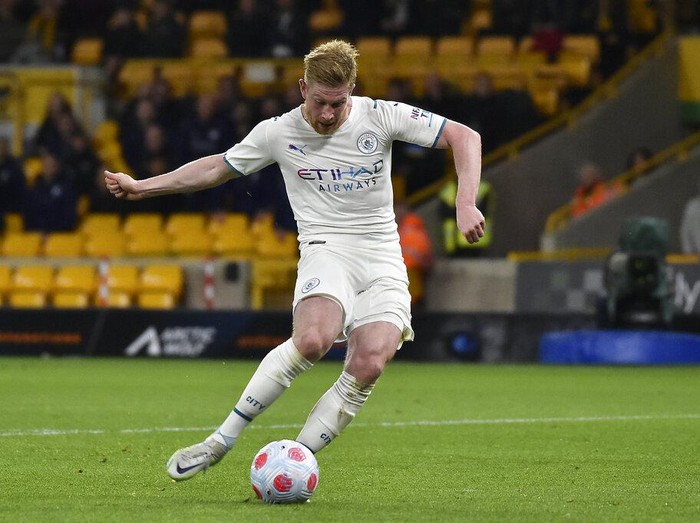 Manchester City's Kevin De Bruyne scores his fourth goal during the English Premier League soccer match between Wolverhampton Wanderers and Manchester City at Molineux stadium in Wolverhampton, England, Wednesday, May 11, 2022. (AP Photo/Rui Vieira)