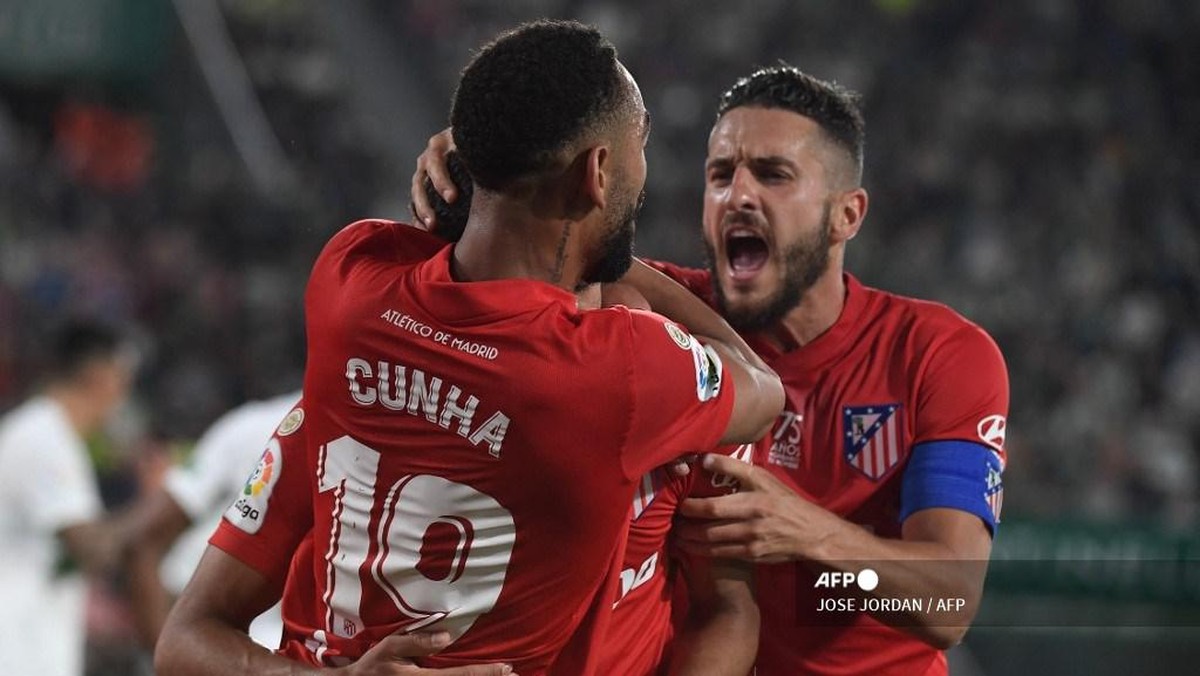 Penyerang Atletico, Matheus Cunha, merayakan gol ke gawang Elche. (Foto: JOSE JORDAN/AFP)