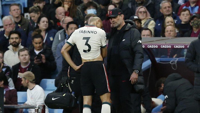 Soccer Football - Premier League - Aston Villa v Liverpool, Villa Park, Birmingham, Britain - May 10, 2022 Liverpool manager Juergen Klopp with Fabinho as he is substituted REUTERS/Craig Brough EDITORIAL USE ONLY. No use with unauthorized audio, video, data, fixture lists, club/league logos or live services. Online in-match use limited to 75 images, no video emulation. No use in betting, games or single club /league/player publications.  Please contact your account representative for further details.