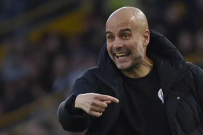 Manchester Citys head coach Pep Guardiola gestures during the English Premier League soccer match between Wolverhampton Wanderers and Manchester City at Molineux stadium in Wolverhampton, England, Wednesday, May 11, 2022. (AP Photo/Rui Vieira)