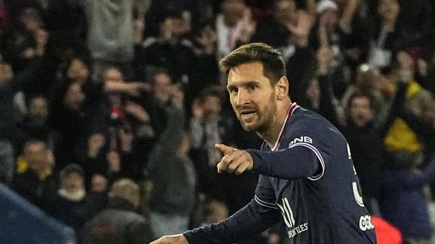 PSG's Lionel Messi celebrates after scoring the opening goal during the French League One soccer match between Paris Saint Germain and Lens at Parc des Princes stadium in Paris, Saturday, April 23, 2022. (AP Photo/Michel Euler)