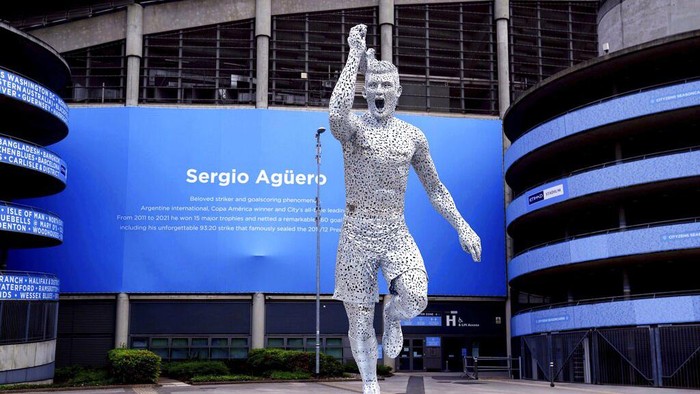 A statue of Manchester City Club legend, Argentinian Sergio Aguero, designed by sculptor Andy Scott is unveiled outside the Etihad Stadium, to commemorate the tenth anniversary of the Club's first Premier League title and the iconic '93:20' moment in Manchester, England, Friday May 13, 2022. (Martin Rickett/PA via AP)