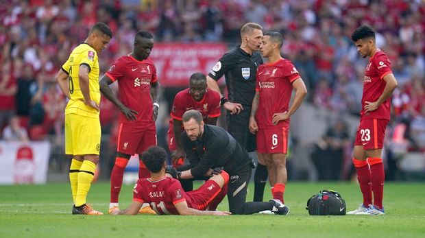 Chelsea vs Liverpool Liverpool's Mohamed Salah receives medical attention during the Emirates FA Cup final at Wembley Stadium, London. Picture date: Saturday May 14, 2022. (Photo by Nick Potts/PA Images via Getty Images)