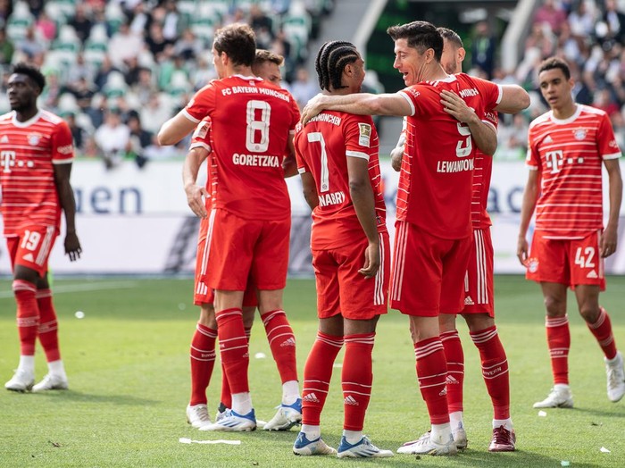 14 May 2022, Lower Saxony, Wolfsburg: Soccer: Bundesliga, VfL Wolfsburg - Bayern Munich, Matchday 34, Volkswagen Arena. Munichs Robert Lewandowski celebrates after his goal to make it 0:2. Photo: Swen Pförtner/dpa - IMPORTANT NOTE: In accordance with the requirements of the DFL Deutsche Fußball Liga and the DFB Deutscher Fußball-Bund, it is prohibited to use or have used photographs taken in the stadium and/or of the match in the form of sequence pictures and/or video-like photo series. (Photo by Swen Pförtner/picture alliance via Getty Images)