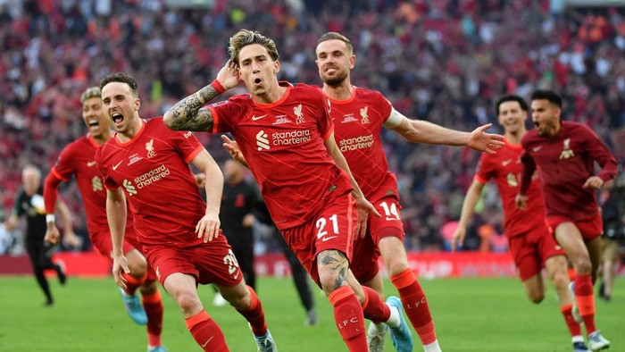 LONDON, ENGLAND - MAY 14: Kostas Tsimikas of Liverpool celebrates following their teams victory in the penalty shoot out during The FA Cup Final match between Chelsea and Liverpool at Wembley Stadium on May 14, 2022 in London, England. (Photo by Tom Dulat - The FA/The FA via Getty Images)