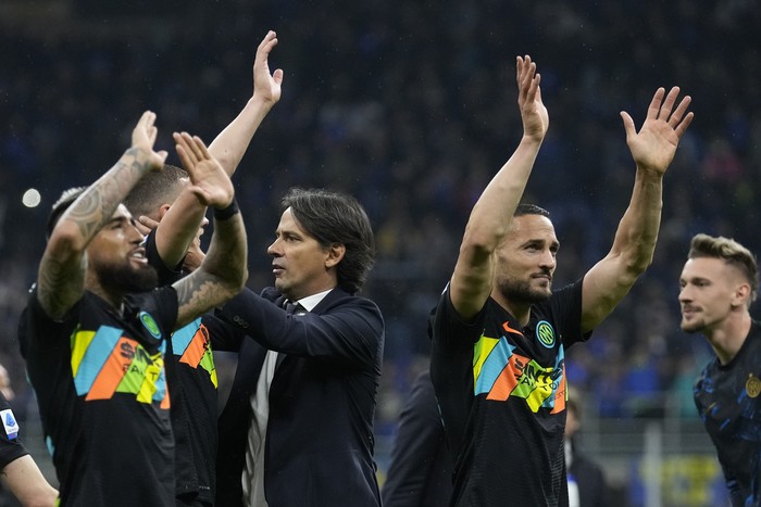 Inter Milans head coach Simone Inzaghi, center, celebrates with his players after the end of the Serie A soccer match between Inter Milan and Empoli at the San Siro Stadium, in Milan, Italy, on Friday, May 6, 2022. Inter Milan won the game 4-2. (AP Photo/Antonio Calanni)