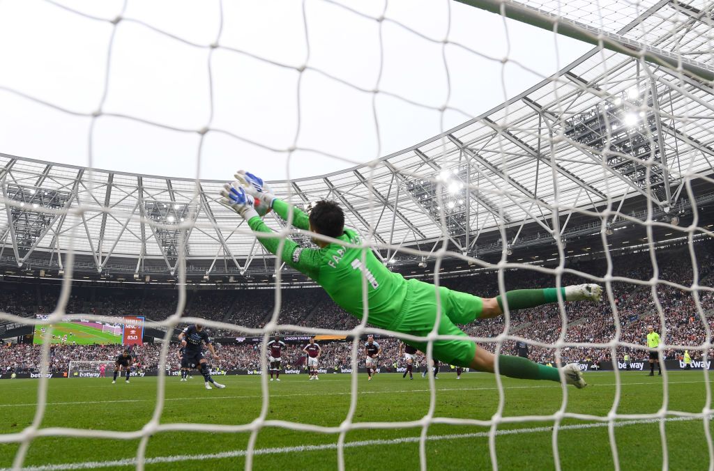 LONDON, ENGLAND - MAY 15: Lukasz Fabianski of West Ham United saves a penalty from Riyad Mahrez of Manchester City  during the Premier League match between West Ham United and Manchester City at London Stadium on May 15, 2022 in London, England. (Photo by Mike Hewitt/Getty Images)