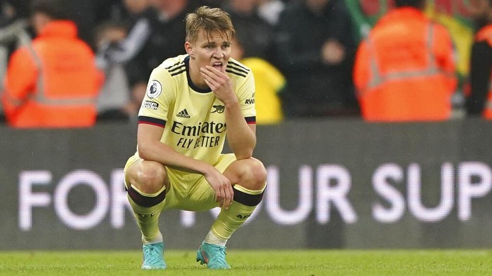 Arsenals Martin Odegaard appears dejected after the English Premier League soccer match against Newcastle United at St. James Park, Newcastle upon Tyne, England, Monday May 16, 2022. (Owen Humphreys/PA via AP)