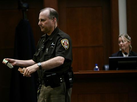 A Fairfax County Deputy Sheriff holds a knife, that actor Amber Heard gifted to actor Johnny Depp in 2012, in the courtroom at the Fairfax County Circuit Courthouse in Fairfax, Virginia, U.S., May 17, 2022. Brendan Smialowski/Pool via REUTERS