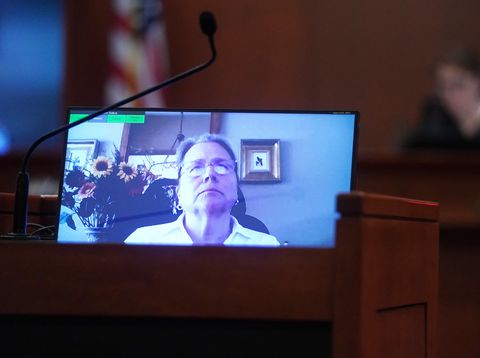 Disney Executive Tina Newman appears on a monitor in a February 2022 recorded deposition played during the 50 million US dollar Depp vs Heard defamation trial at the Fairfax County Circuit Court in Fairfax, Virginia, on May 19, 2022. Actor Johnny Depp is suing ex-wife Amber Heard for libel after she wrote an op-ed piece in The Washington Post in 2018 referring to herself as a “public figure representing domestic abuse.”Shawn THEW / POOL / AFP